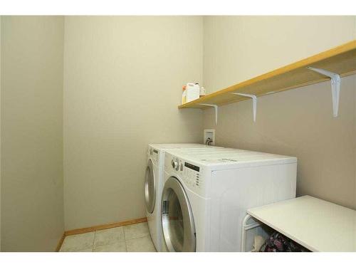 35 Wentworth Gardens Sw, Calgary, AB - Indoor Photo Showing Laundry Room