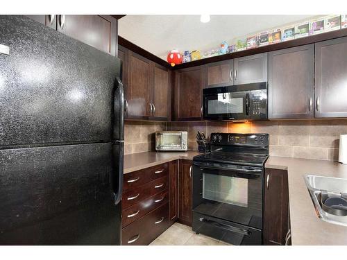 4102-31 Country Village Manor Ne, Calgary, AB - Indoor Photo Showing Kitchen With Double Sink