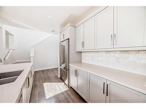 247 Precedence Hill, Cochrane, AB - Indoor Photo Showing Kitchen With Double Sink