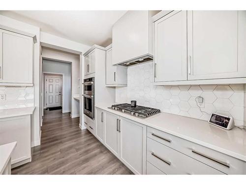 247 Precedence Hill, Cochrane, AB - Indoor Photo Showing Kitchen With Upgraded Kitchen