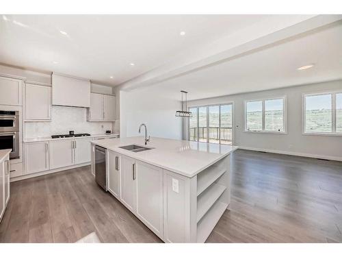 247 Precedence Hill, Cochrane, AB - Indoor Photo Showing Kitchen With Double Sink With Upgraded Kitchen