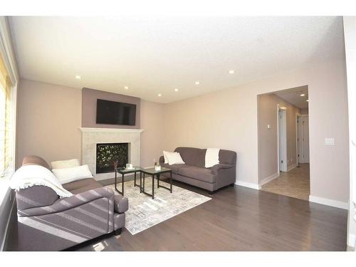 12 Riverside Crescent Se, Calgary, AB - Indoor Photo Showing Living Room With Fireplace