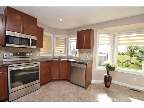 12 Riverside Crescent Se, Calgary, AB - Indoor Photo Showing Kitchen With Double Sink