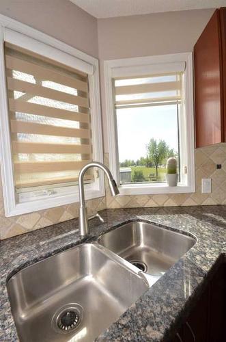 12 Riverside Crescent Se, Calgary, AB - Indoor Photo Showing Kitchen With Double Sink