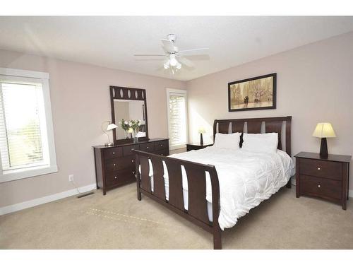 12 Riverside Crescent Se, Calgary, AB - Indoor Photo Showing Bedroom