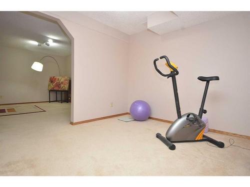 12 Riverside Crescent Se, Calgary, AB - Indoor Photo Showing Gym Room