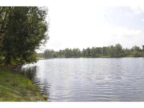 12 Riverside Crescent Se, Calgary, AB - Outdoor With Body Of Water With View