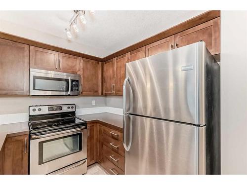 2317-130 Panatella Street Nw, Calgary, AB - Indoor Photo Showing Kitchen With Stainless Steel Kitchen