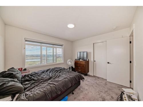 204-414 Seton Passage, Calgary, AB - Indoor Photo Showing Bedroom