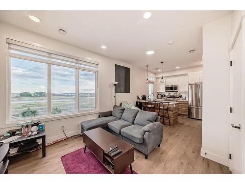 204-414 Seton Passage, Calgary, AB - Indoor Photo Showing Living Room