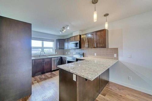 214 Covecreek Circle Ne, Calgary, AB - Indoor Photo Showing Kitchen With Upgraded Kitchen