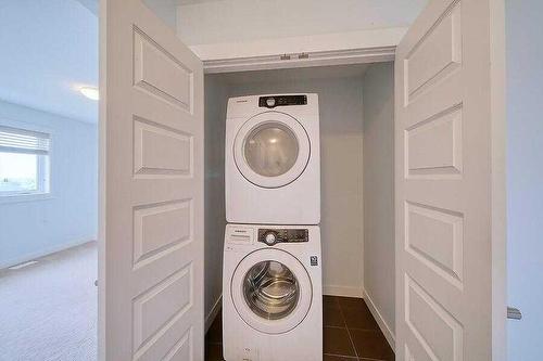 214 Covecreek Circle Ne, Calgary, AB - Indoor Photo Showing Laundry Room