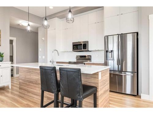 412-19661 40 Street Se, Calgary, AB - Indoor Photo Showing Kitchen With Upgraded Kitchen