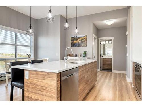 412-19661 40 Street Se, Calgary, AB - Indoor Photo Showing Kitchen With Upgraded Kitchen