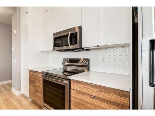 412-19661 40 Street Se, Calgary, AB - Indoor Photo Showing Kitchen With Upgraded Kitchen