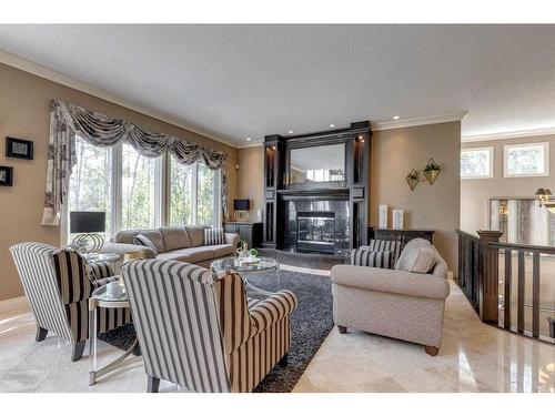 59 Wentwillow Lane Sw, Calgary, AB - Indoor Photo Showing Living Room With Fireplace