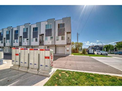 203-101 Panatella Square Nw, Calgary, AB - Outdoor With Facade