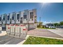 203-101 Panatella Square Nw, Calgary, AB  - Outdoor With Facade 