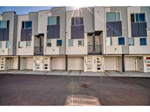 203-101 Panatella Square Nw, Calgary, AB - Outdoor With Balcony With Facade