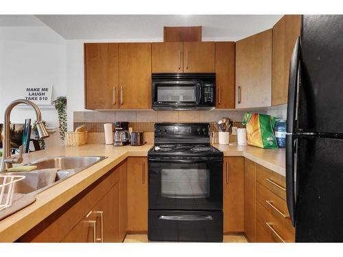 1302-210 15 Avenue Se, Calgary, AB - Indoor Photo Showing Kitchen With Double Sink