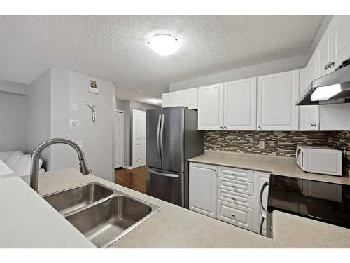 7 Citadel Meadow Gardens Nw, Calgary, AB - Indoor Photo Showing Kitchen With Stainless Steel Kitchen With Double Sink