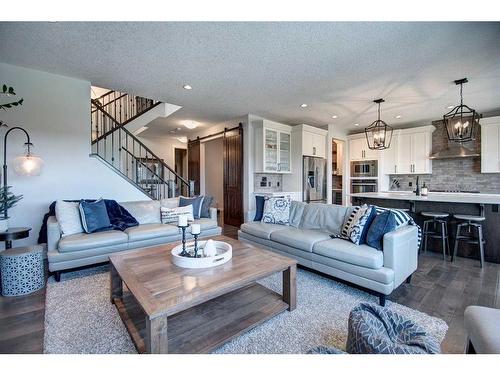 149 Kingsmere Cove Se, Airdrie, AB - Indoor Photo Showing Living Room