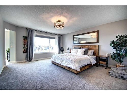 149 Kingsmere Cove Se, Airdrie, AB - Indoor Photo Showing Bedroom