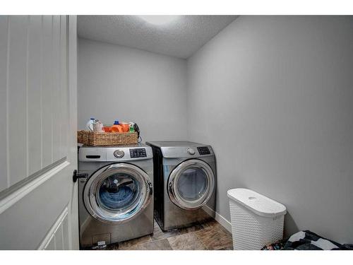 149 Kingsmere Cove Se, Airdrie, AB - Indoor Photo Showing Laundry Room