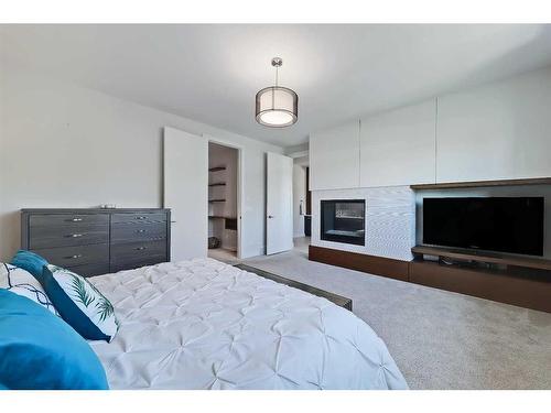 1722 47 Avenue Sw, Calgary, AB - Indoor Photo Showing Bedroom With Fireplace