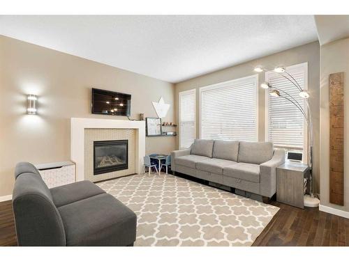 364 Nolan Hill Boulevard Nw, Calgary, AB - Indoor Photo Showing Living Room With Fireplace