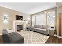 364 Nolan Hill Boulevard Nw, Calgary, AB  - Indoor Photo Showing Living Room With Fireplace 