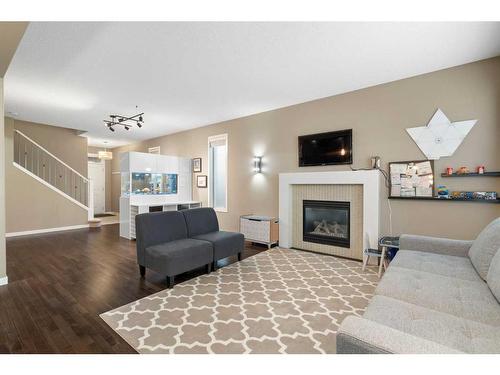 364 Nolan Hill Boulevard Nw, Calgary, AB - Indoor Photo Showing Living Room With Fireplace