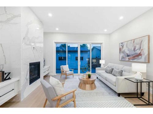 915 36 Street Nw, Calgary, AB - Indoor Photo Showing Living Room With Fireplace