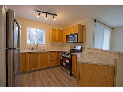 101-3000 Somervale Court Sw, Calgary, AB - Indoor Photo Showing Kitchen