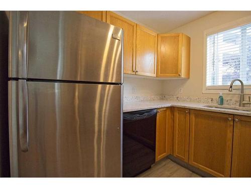 101-3000 Somervale Court Sw, Calgary, AB - Indoor Photo Showing Kitchen