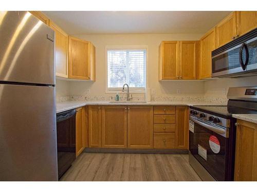 101-3000 Somervale Court Sw, Calgary, AB - Indoor Photo Showing Kitchen