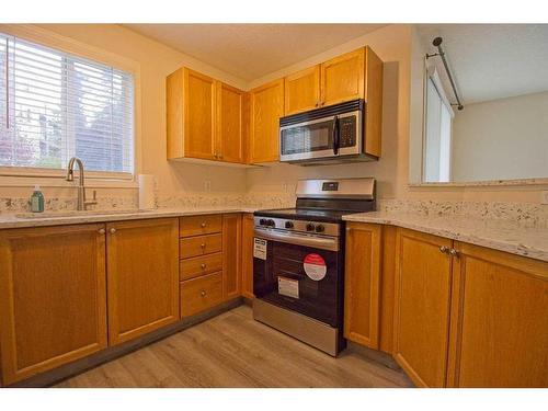 101-3000 Somervale Court Sw, Calgary, AB - Indoor Photo Showing Kitchen