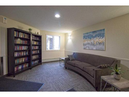 101-3000 Somervale Court Sw, Calgary, AB - Indoor Photo Showing Living Room