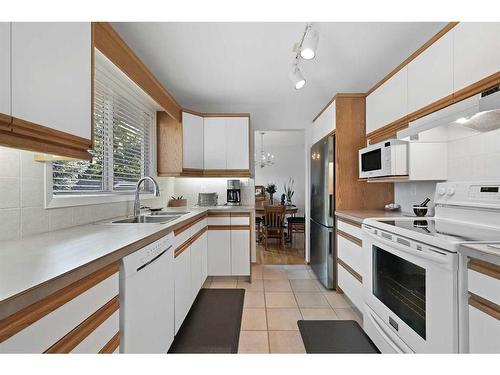 107 Palis Way Sw, Calgary, AB - Indoor Photo Showing Kitchen With Double Sink