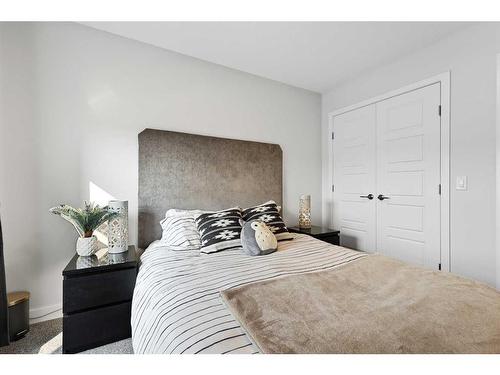 138 Wolf Creek Rise Se, Calgary, AB - Indoor Photo Showing Bedroom