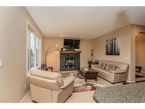 107 Everoak Green Sw, Calgary, AB - Indoor Photo Showing Living Room With Fireplace