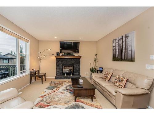 107 Everoak Green Sw, Calgary, AB - Indoor Photo Showing Living Room With Fireplace