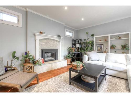 6632 Dalrymple Way Nw, Calgary, AB - Indoor Photo Showing Living Room With Fireplace