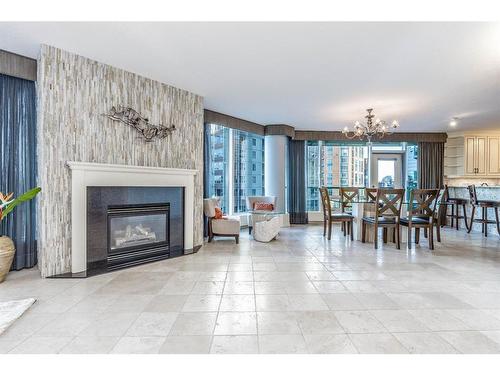 404-837 2 Avenue Sw, Calgary, AB - Indoor Photo Showing Living Room With Fireplace