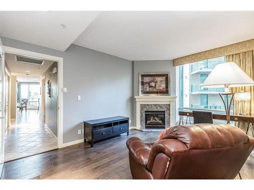 404-837 2 Avenue Sw, Calgary, AB - Indoor Photo Showing Living Room With Fireplace