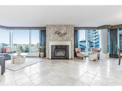 404-837 2 Avenue Sw, Calgary, AB - Indoor Photo Showing Living Room With Fireplace