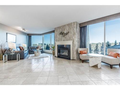 404-837 2 Avenue Sw, Calgary, AB - Indoor Photo Showing Living Room With Fireplace