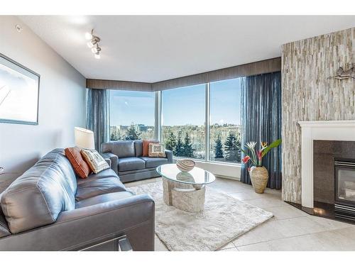 404-837 2 Avenue Sw, Calgary, AB - Indoor Photo Showing Living Room With Fireplace