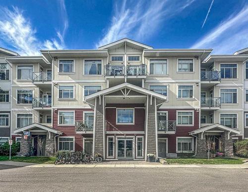 406-10 Auburn Bay Link Se, Calgary, AB - Outdoor With Balcony With Facade