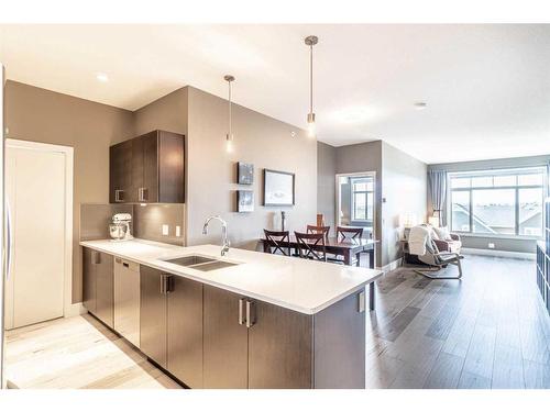 406-10 Auburn Bay Link Se, Calgary, AB - Indoor Photo Showing Kitchen With Double Sink